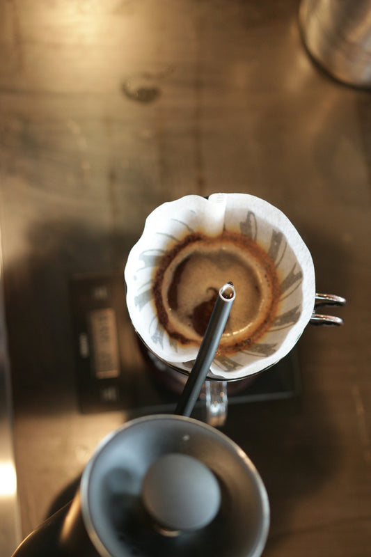 an espresso machine with a cup of coffee on top of it